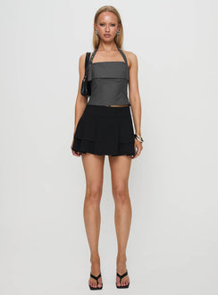   side view of model wearing Princess Polly Yeva Pleat Mini Skirt Black Mini Skirts Skirts 