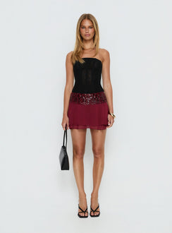   side view of model wearing Princess Polly Zenayda Drop Waist Sequin Mini Skirt Burgundy Mini Skirts Skirts 