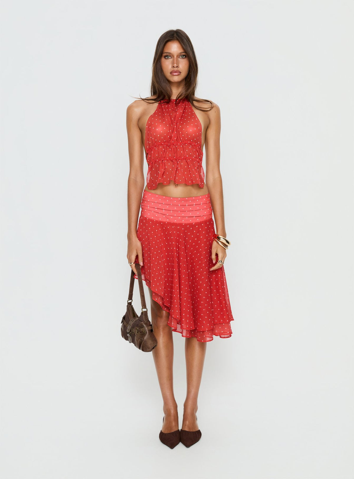   side view of model wearing Princess Polly Legacy Midi Skirt Tomato Polka Skirts 
