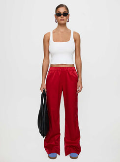 front view of model wearing Princess Polly Travalta Satin Track Pant Red Low Rise Pants Pants 