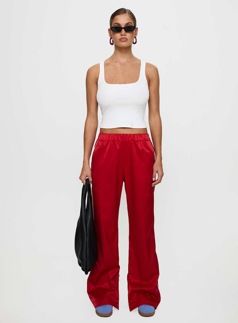front view of model wearing Princess Polly Travalta Satin Track Pant Red Low Rise Pants Pants 