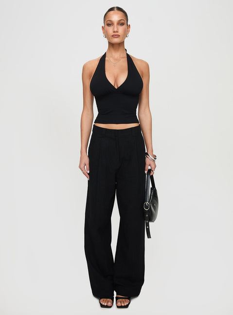 front view of model wearing Princess Polly Whimsy Halter Top Black Sleeveless Plunger 