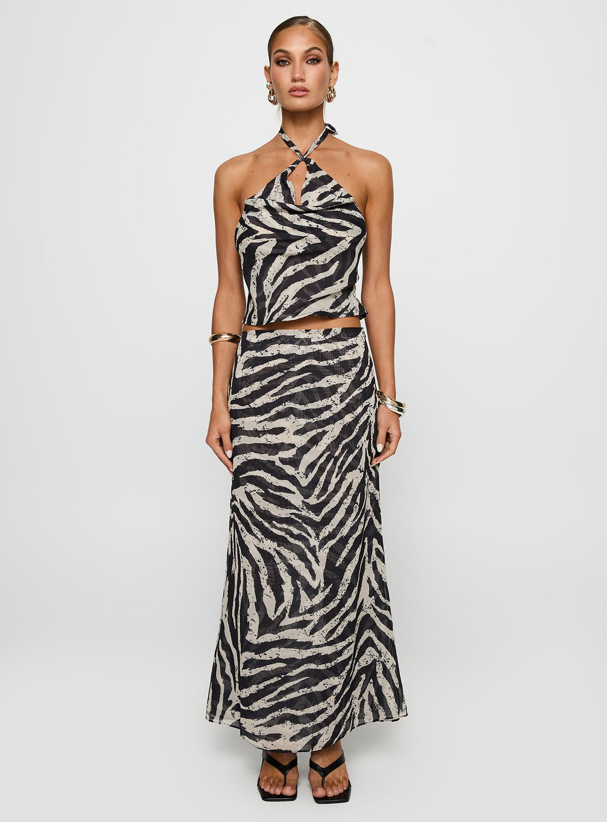 side view of model wearing Princess Polly Eleganza Top Zebra Sleeveless Cowl 
