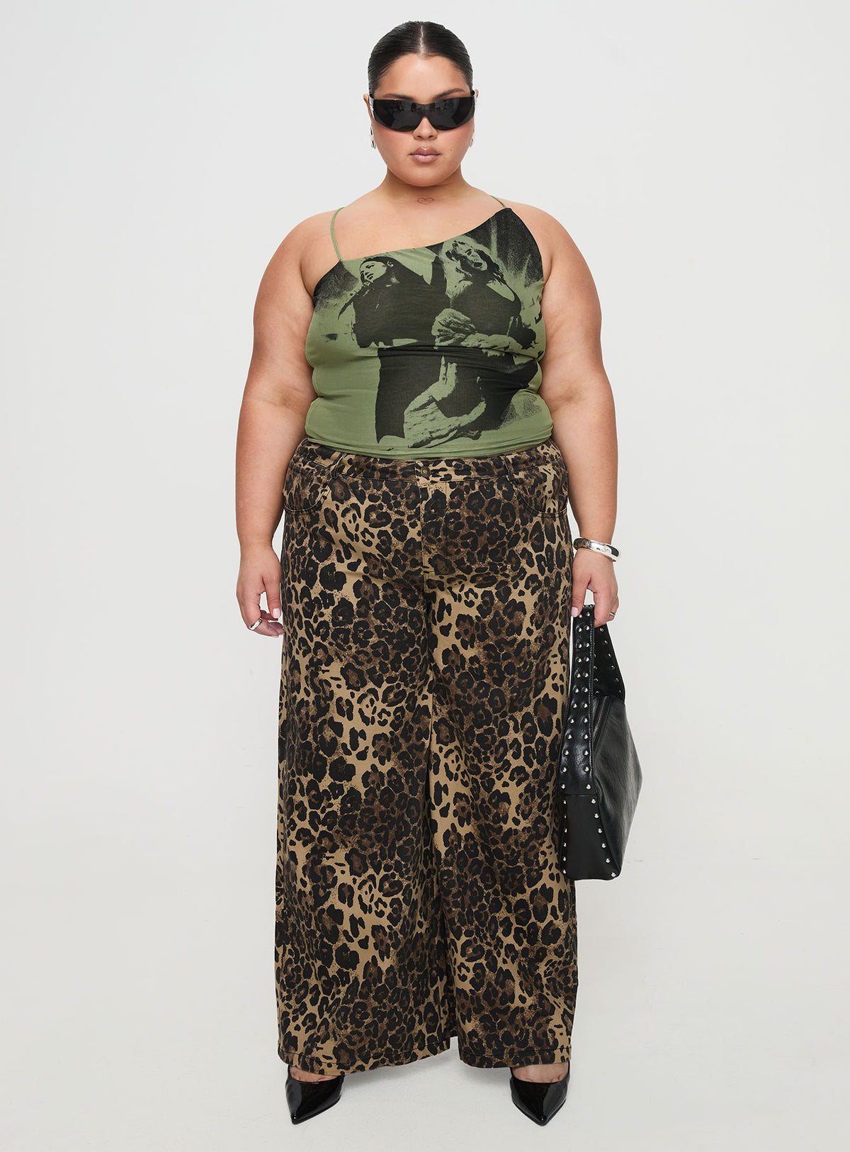 side view of model wearing Princess Polly Pantar Low Rise Pants Leopard Curve Low Rise Pants Pants 