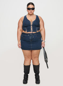   front view of model wearing Princess Polly Popular Low Rise Mini Skirt Mid Blue Wash Curve Mini Skirts Skirts 
