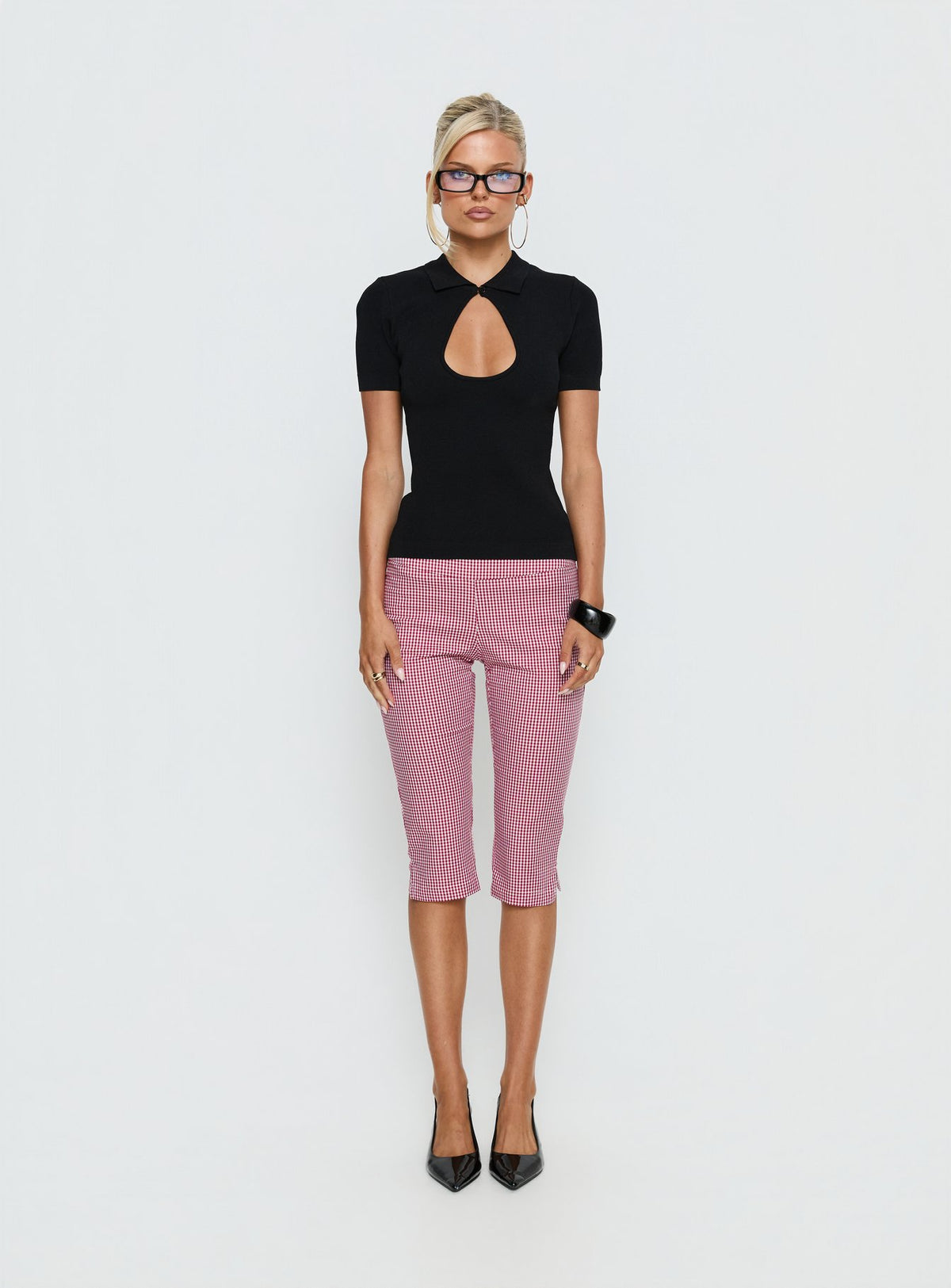Showcasing Rossie Capri Pants Red Gingham womens-regular-pants with high-rise front view of model wearing