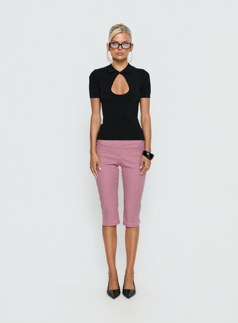 Showcasing Rossie Capri Pants Red Gingham womens-regular-pants with high-rise front view of model wearing