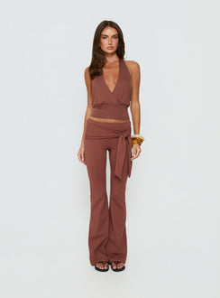 Showcasing the Daily Define Tie Waist Pants Brown in womens regular pants with high-rise and wide-leg styling front view of model wearing Princess Polly