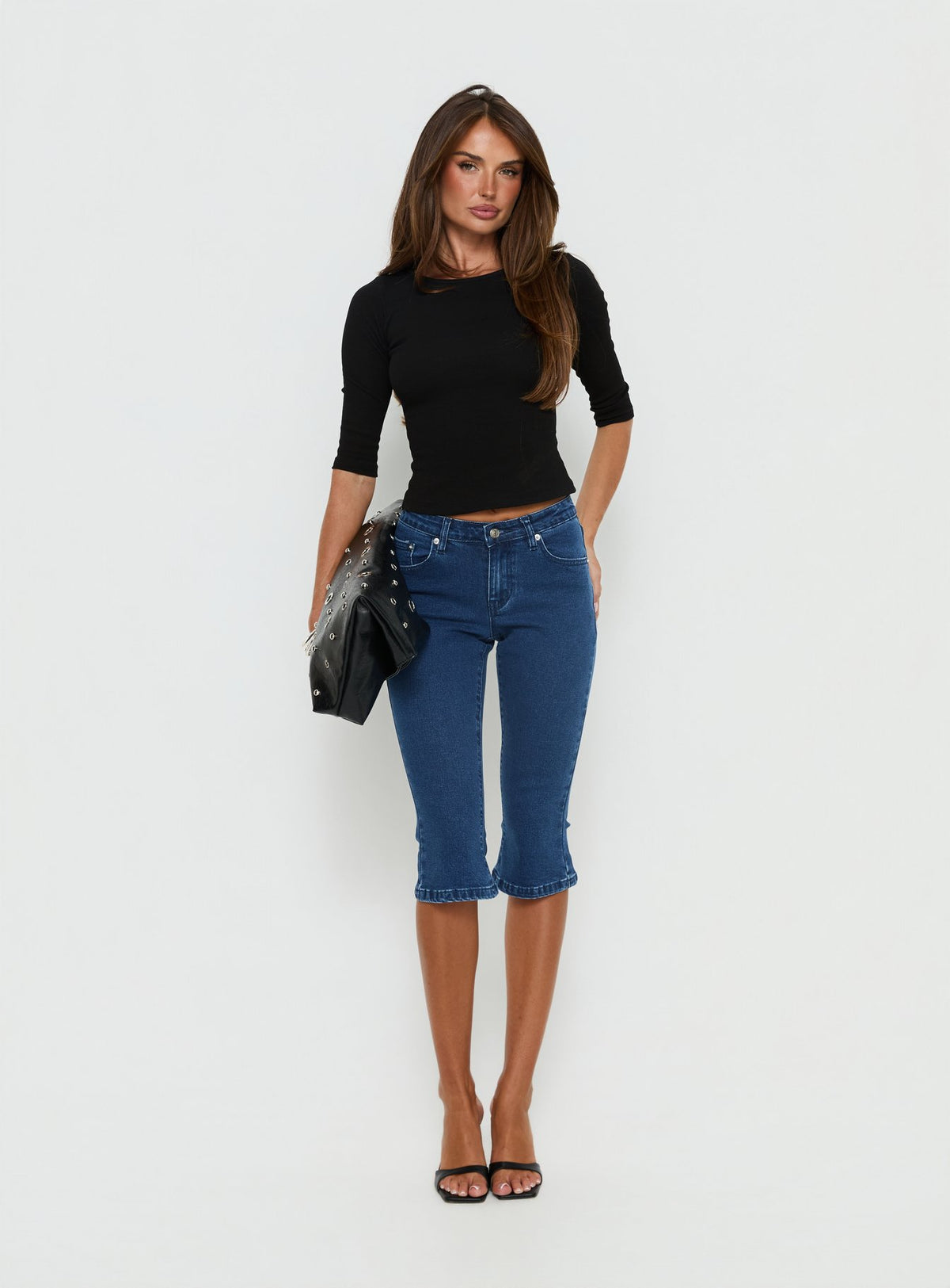 front view of model wearing Princess Polly Kissimo Kick Flare Capri Pants Indigo Blue Mid Rise Jeans Jeans 