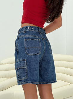 back view of model wearing Princess Polly Mika Carpenter Denim Shorts Mid Wash High Waisted Shorts 