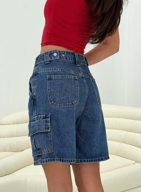 back view of model wearing Princess Polly Mika Carpenter Denim Shorts Mid Wash High Waisted Shorts 