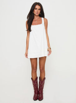 side view of model wearing Princess Polly Alanah Mini Dress White Petite Square Neck 