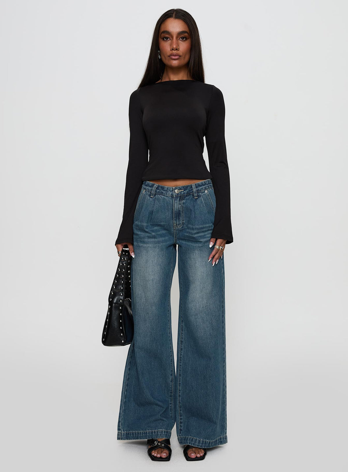 front view of model wearing Princess Polly Laguardia Mid Rise Wide Leg Jeans Dark Blue Wash Mid Rise Jeans Jeans 