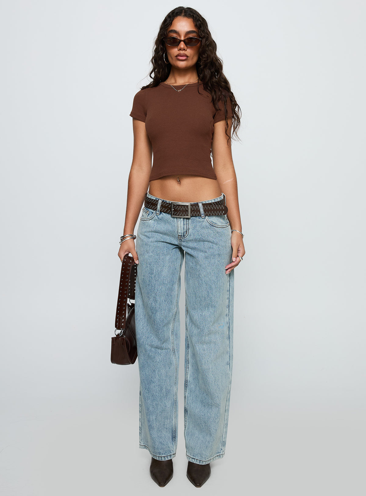 front view of model wearing Princess Polly Ellanor Low Rise Slouch Denim Jean Light Blue Low Rise Jeans 