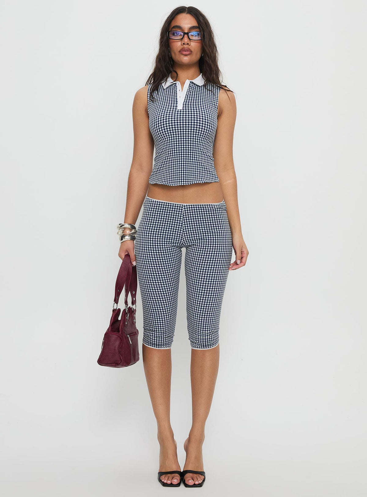 front view of model wearing Princess Polly Tuka Capri Navy Gingham Mid Rise Pants Pants 