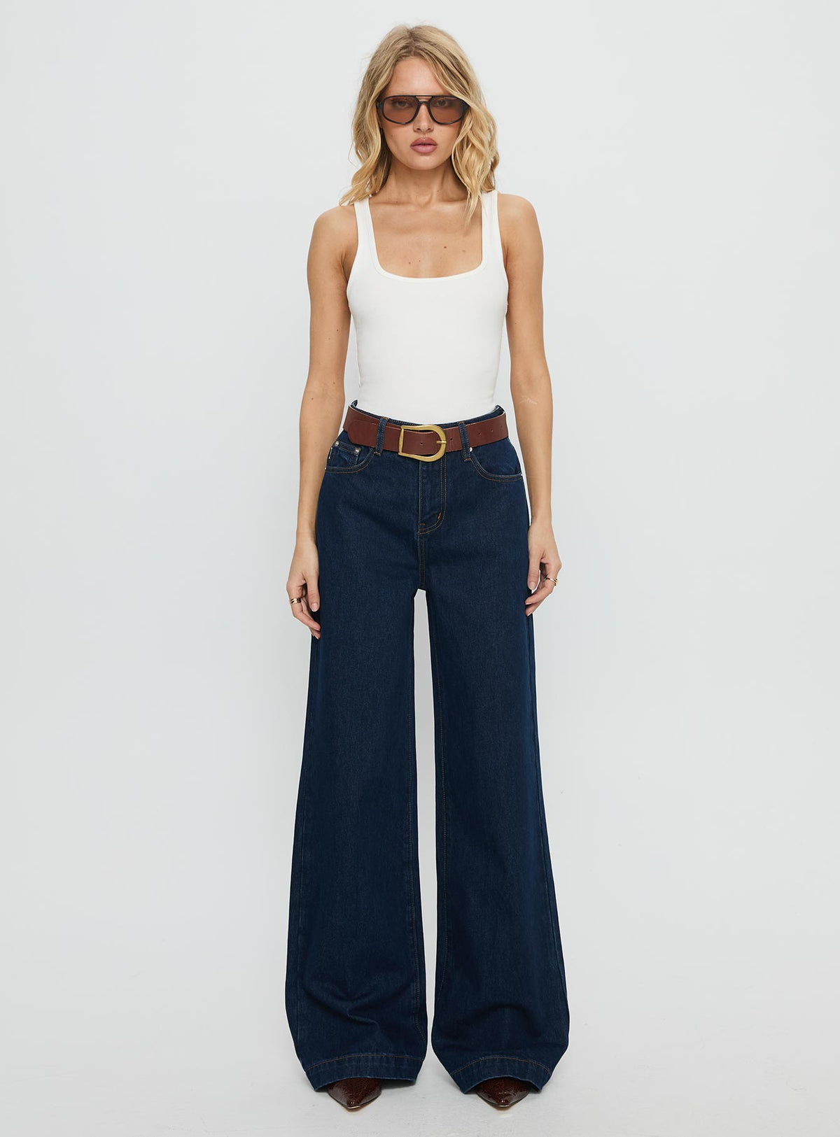 front view of model wearing Princess Polly Goldie High Rise Wide Leg Jeans Indigo High Rise Jeans Jeans 