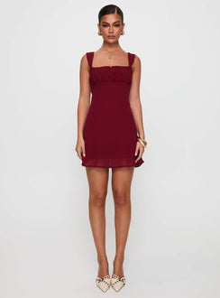 front view of model wearing Princess Polly Solasta Mini Dress Red Straight Neck 