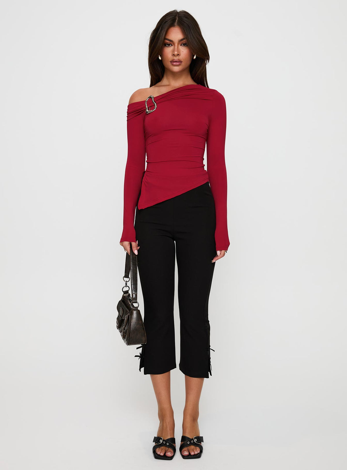 back view of model wearing Princess Polly Donalla Off The Shoulder Hardware Detail Top Red Full Sleeves Asymmetric Neckline 