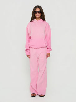 Showcasing the AT Fleece Baggy Sweatpant Washed Pink in womens-regular-pants with mid-rise waist front view of model wearing Princess Polly