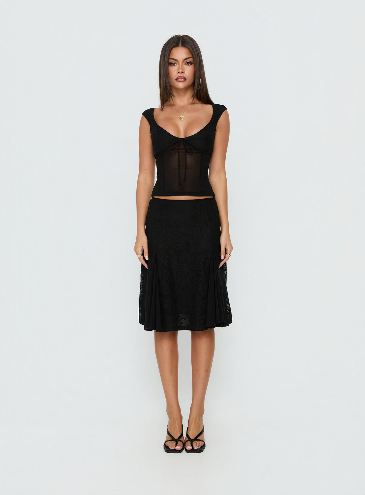 Introducing the Quani Lace Midi Skirt Black womens-skirts with fitted silhouette front view of model wearing Princess Polly