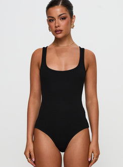 front view of model wearing Princess Polly Baseline Rib Bodysuit Black Sleeveless Bodysuit 