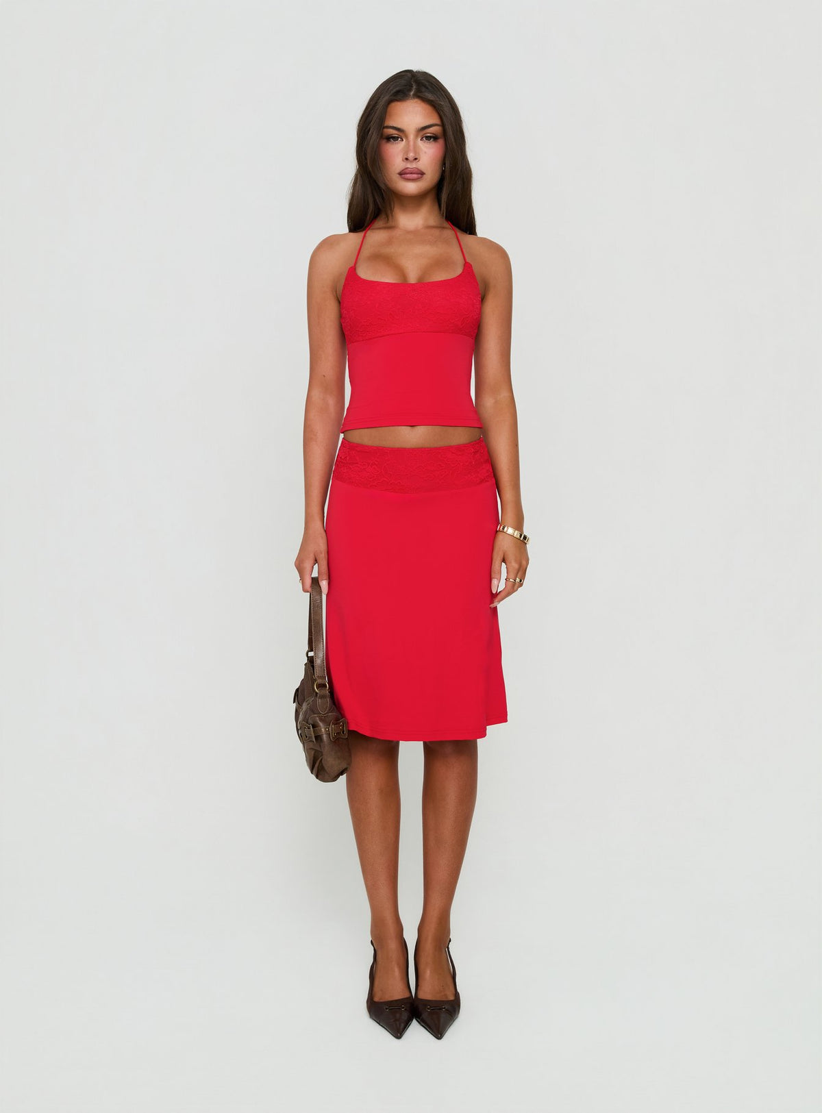 Showcasing the Zenaide Lace Detail Midi Skirt Red in womens-skirts front view of model wearing