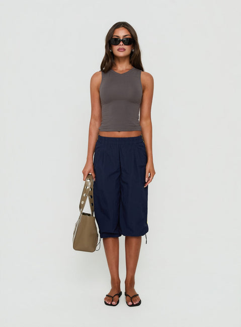 Showcasing the Riyah 3/4 Low Rise Nylon Pants Navy in womens-regular-pants with striped detail front view of model wearing Princess Polly