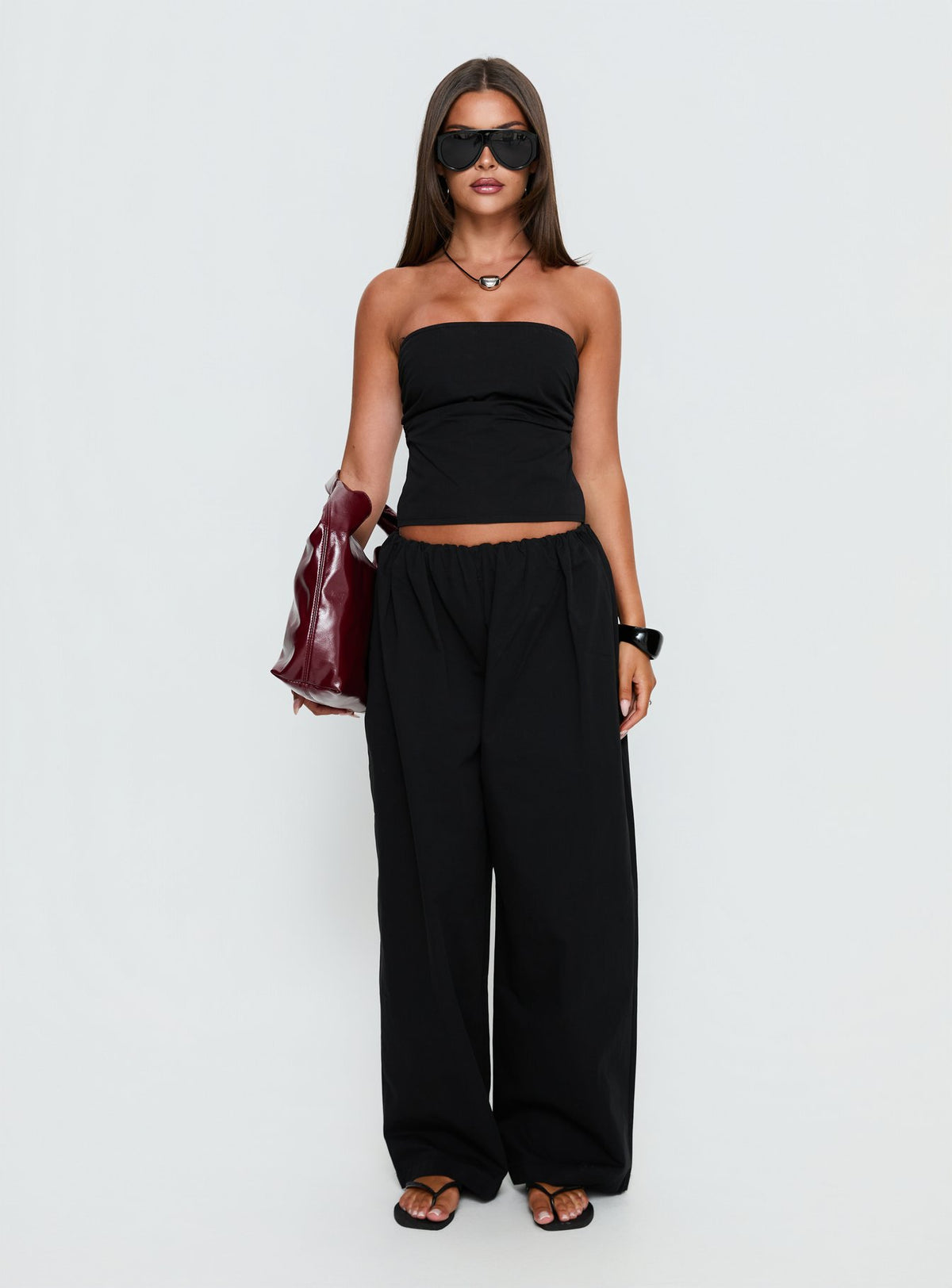 front view of model wearing Princess Polly Tidekiss Pants Noir Mid Rise Pants 