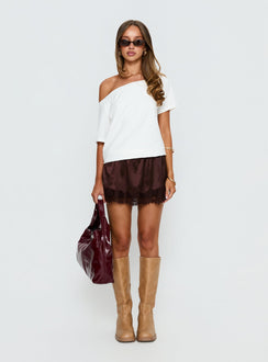   side view of model wearing Princess Polly Orlynn Satin Lace Trim Mini Skirt Brown Mini Skirts Skirts 