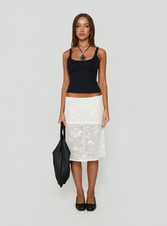 Showcasing the Heart Stealer Sheer Sequin Midi Skirt in White with fitted a-line shape and frayed hem front view of model wearing Princess Polly