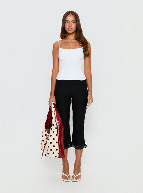 front view of model wearing Princess Polly Darsie Frill Capri Black Polka Dot High Rise Pants Pants 