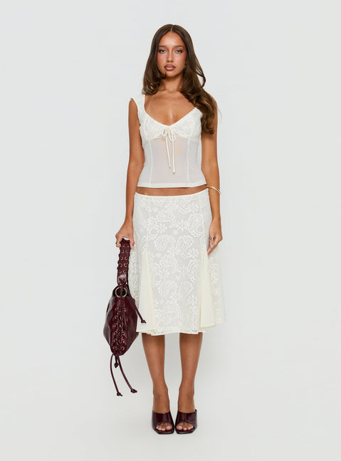 Showcasing the Quani Lace Midi Skirt Cream in womens-skirts with fitted silhouette and floral details front view of model wearing Princess Polly