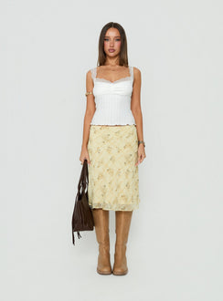 Featuring the Evina Picot Trim Midi Skirt Yellow Paisley womens-skirts with a-line shape, frill details, fitted silhouette, frayed hem, and midi length front view of model wearing Princess Polly