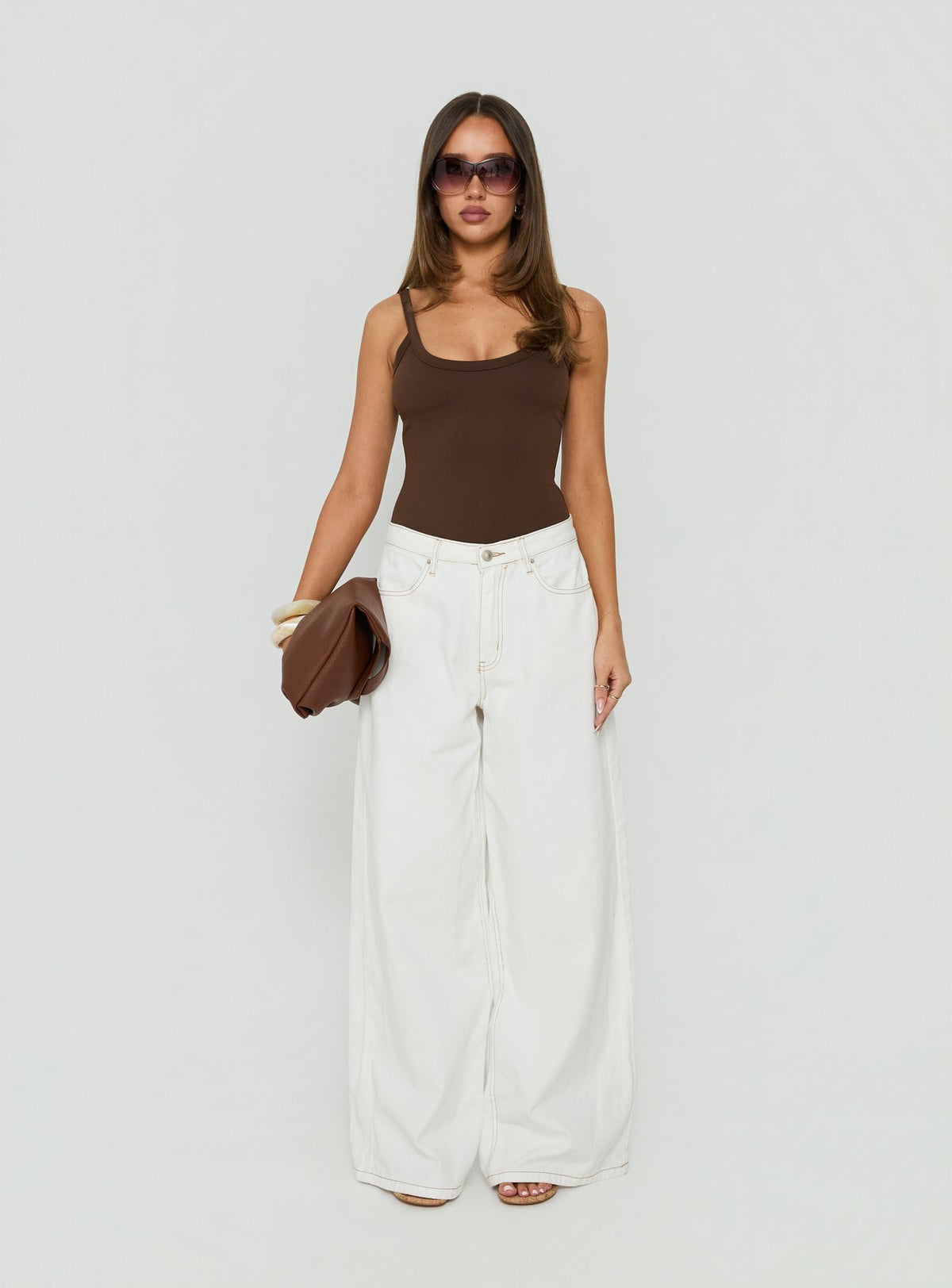 Showcasing the Daily Define Kasper Bodysuit Brown womens-bodysuit with sleeveless design front view of model wearing Princess Polly