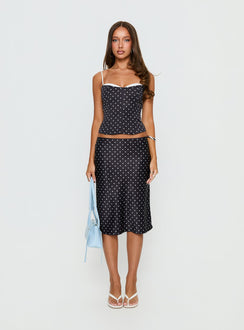 Crafted from the Somani Satin Midi Skirt Black Polka Dot womens-skirts in midi length front view of model wearing