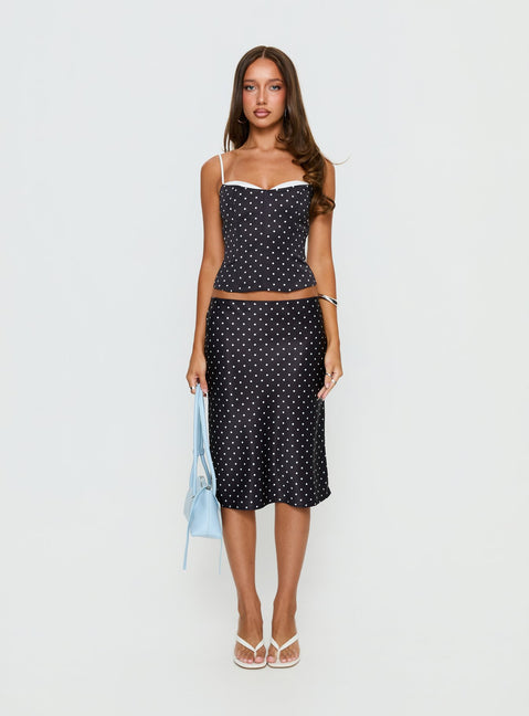 Crafted from the Somani Satin Midi Skirt Black Polka Dot womens-skirts in midi length front view of model wearing
