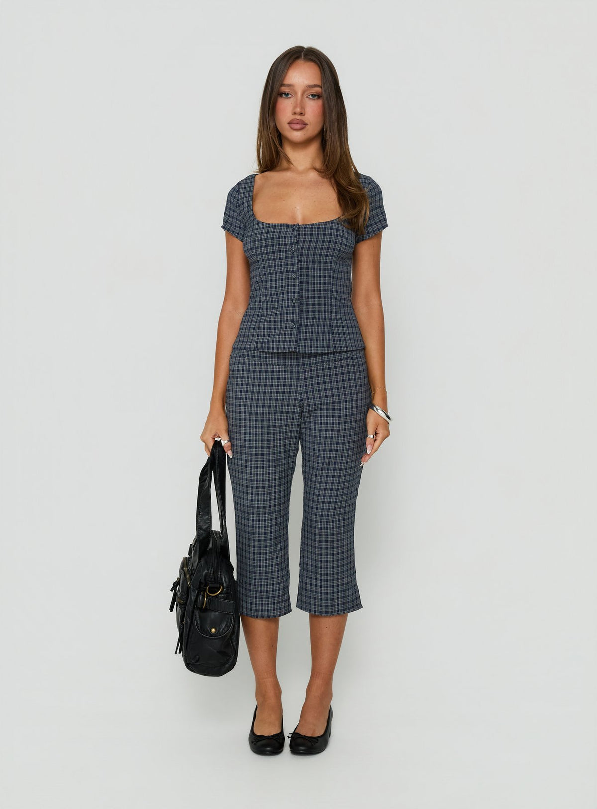 Showcasing the Mayvie Capri Pants Navy Check in womens regular pants with high-rise waist front view of model wearing