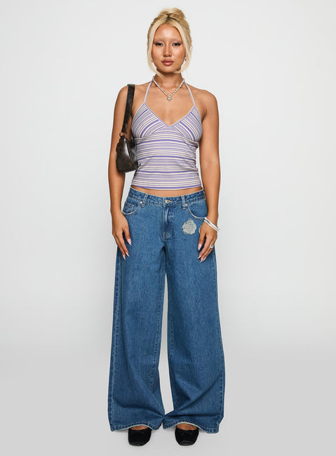 side view of model wearing Princess Polly A Keeper Flower Patch Low Rise Wide Leg Jeans Mid Blue Low Rise Jeans Jeans 
