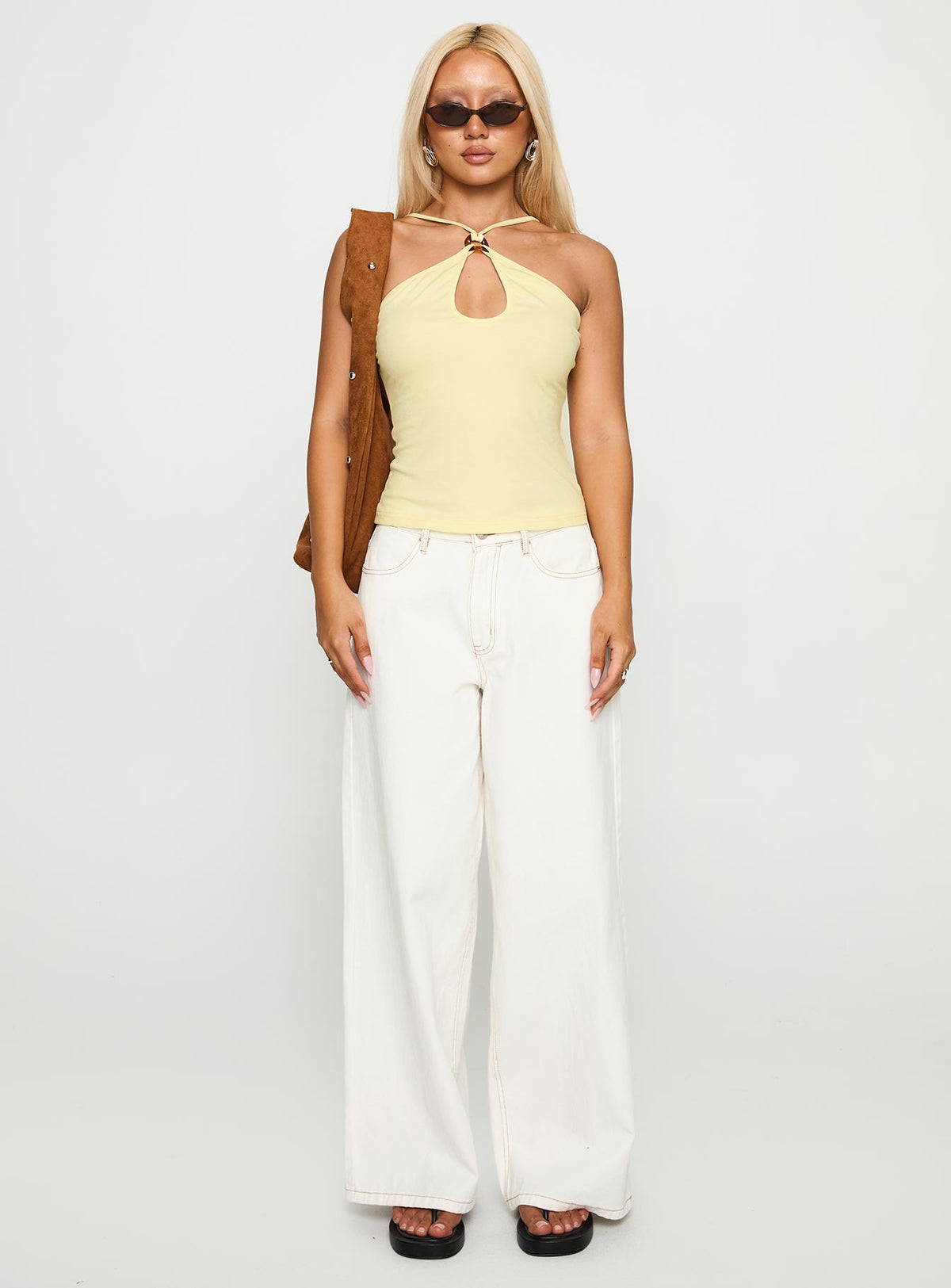back view of model wearing Princess Polly Luminarie Cut Out Top Lemon Sleeveless Asymmetric Neckline 