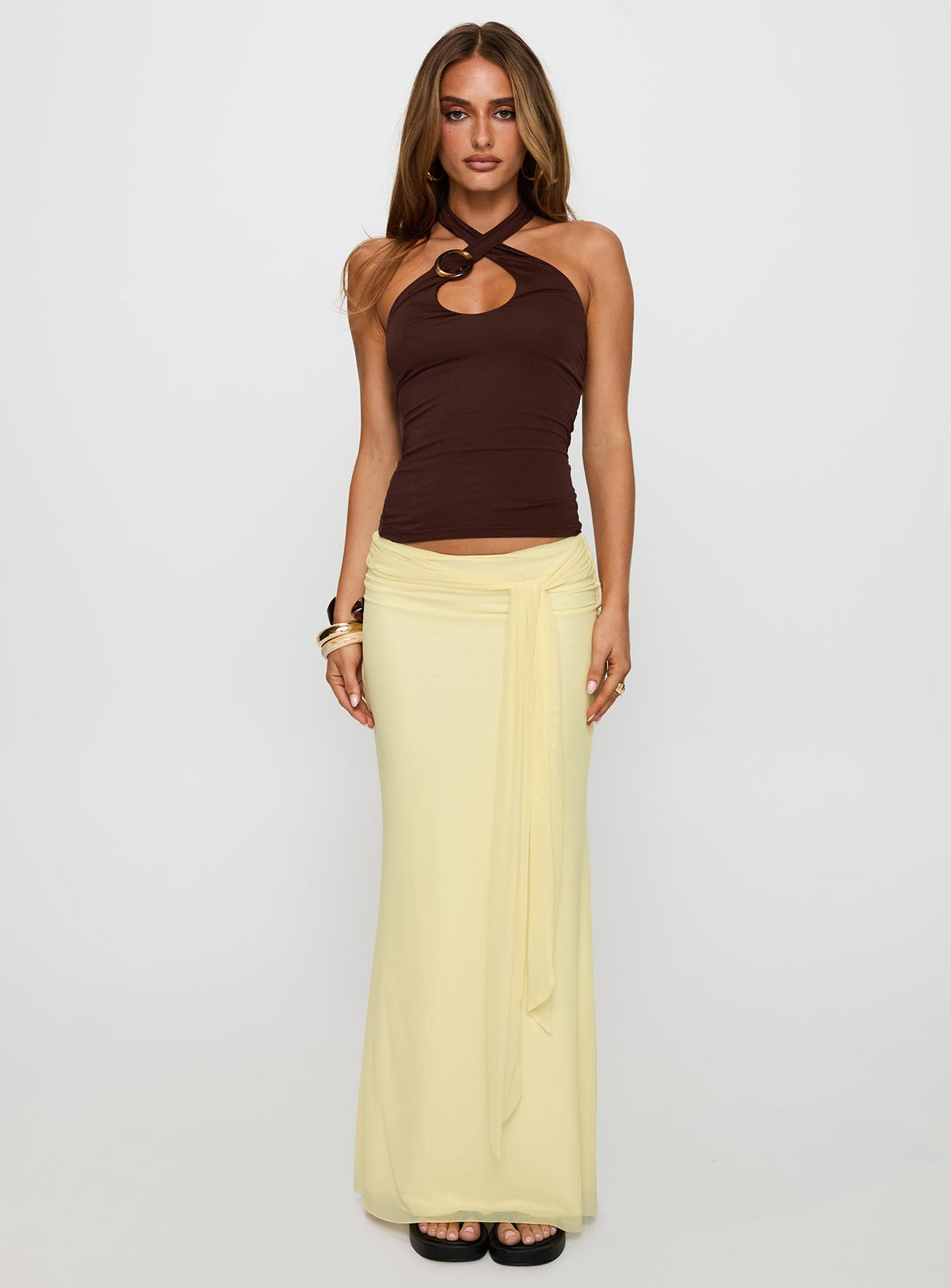 side view of model wearing Princess Polly Quell Top Chocolate Sleeveless Asymmetric Neckline 