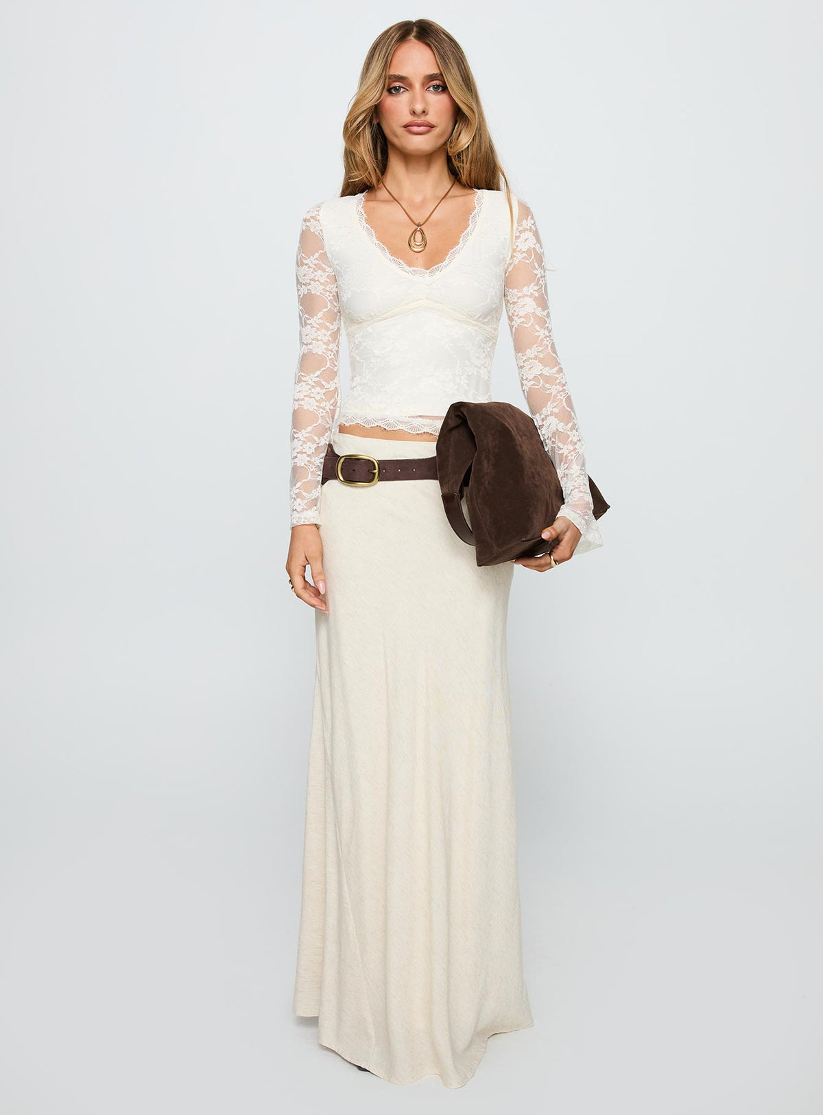 front view of model wearing Princess Polly Pitter Long Sleeve Top Cream Full Sleeves V-Neck 