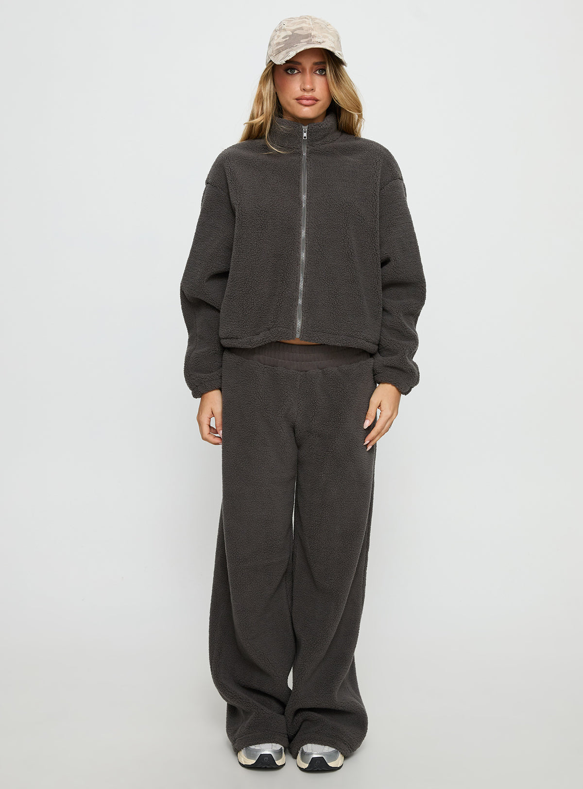 side view of model wearing Princess Polly Siberia Fleece Zip Up Jumper Charcoal regular Jumpers 