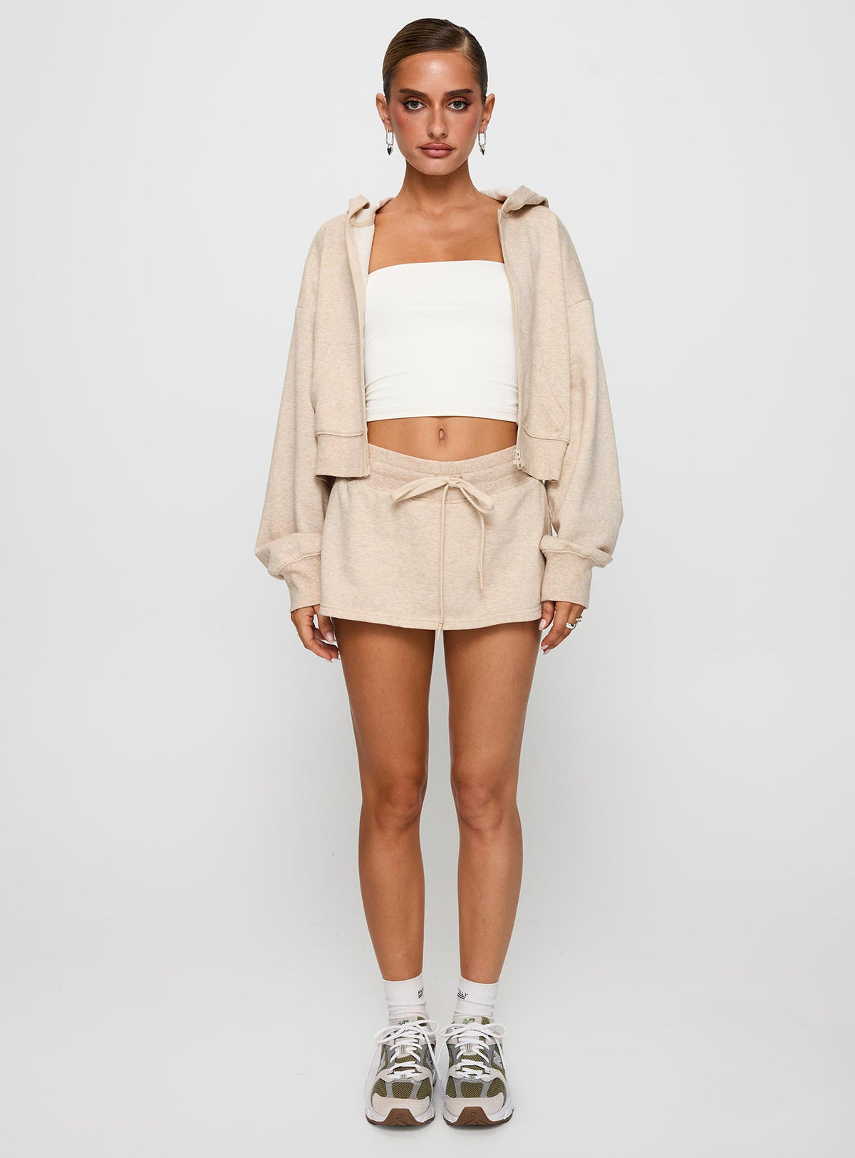 front view of model wearing Princess Polly Down Low Fleece Skort Oat Marle 