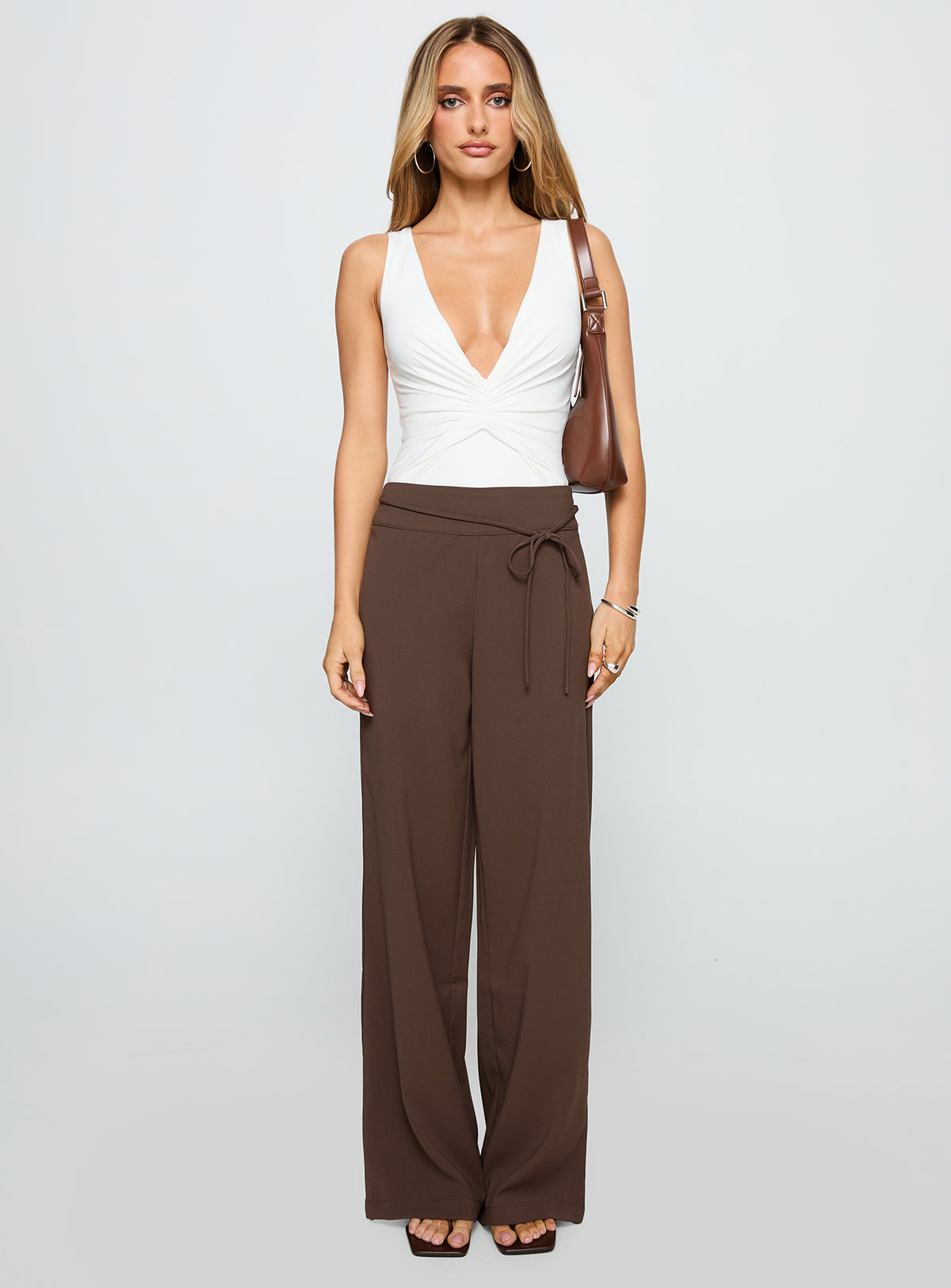 front view of model wearing Princess Polly Rush Hours Pants Chocolate High Rise Pants Pants 