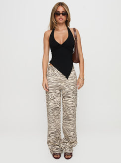 side view of model wearing Princess Polly Top Model Low Rise Straight Leg Jeans Zebra Mid Rise Jeans Jeans 