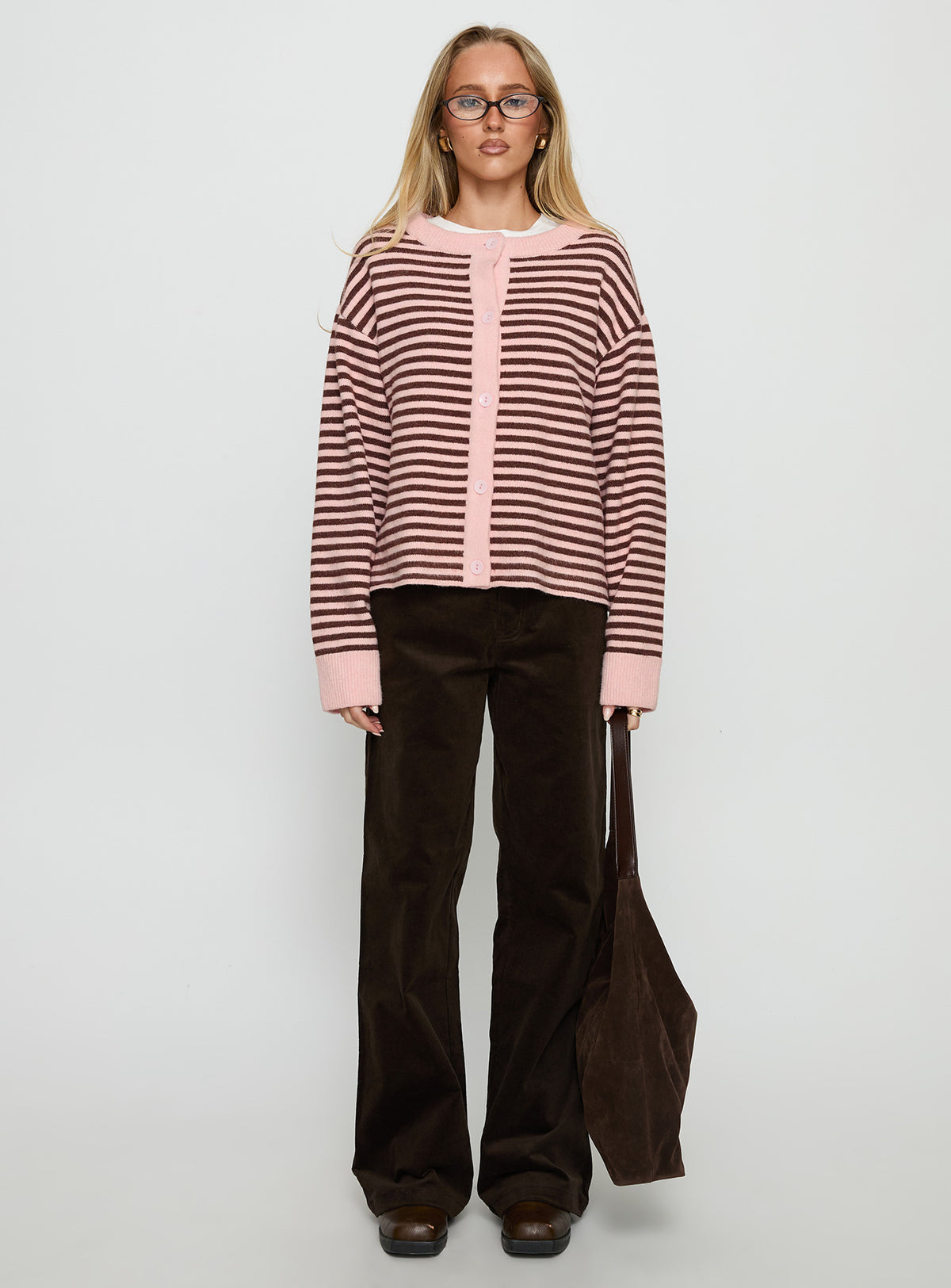 side view of model wearing Princess Polly Darnelle Button Up Knit Cardigan Pink Stripe Longline Jumpers Jumpers 