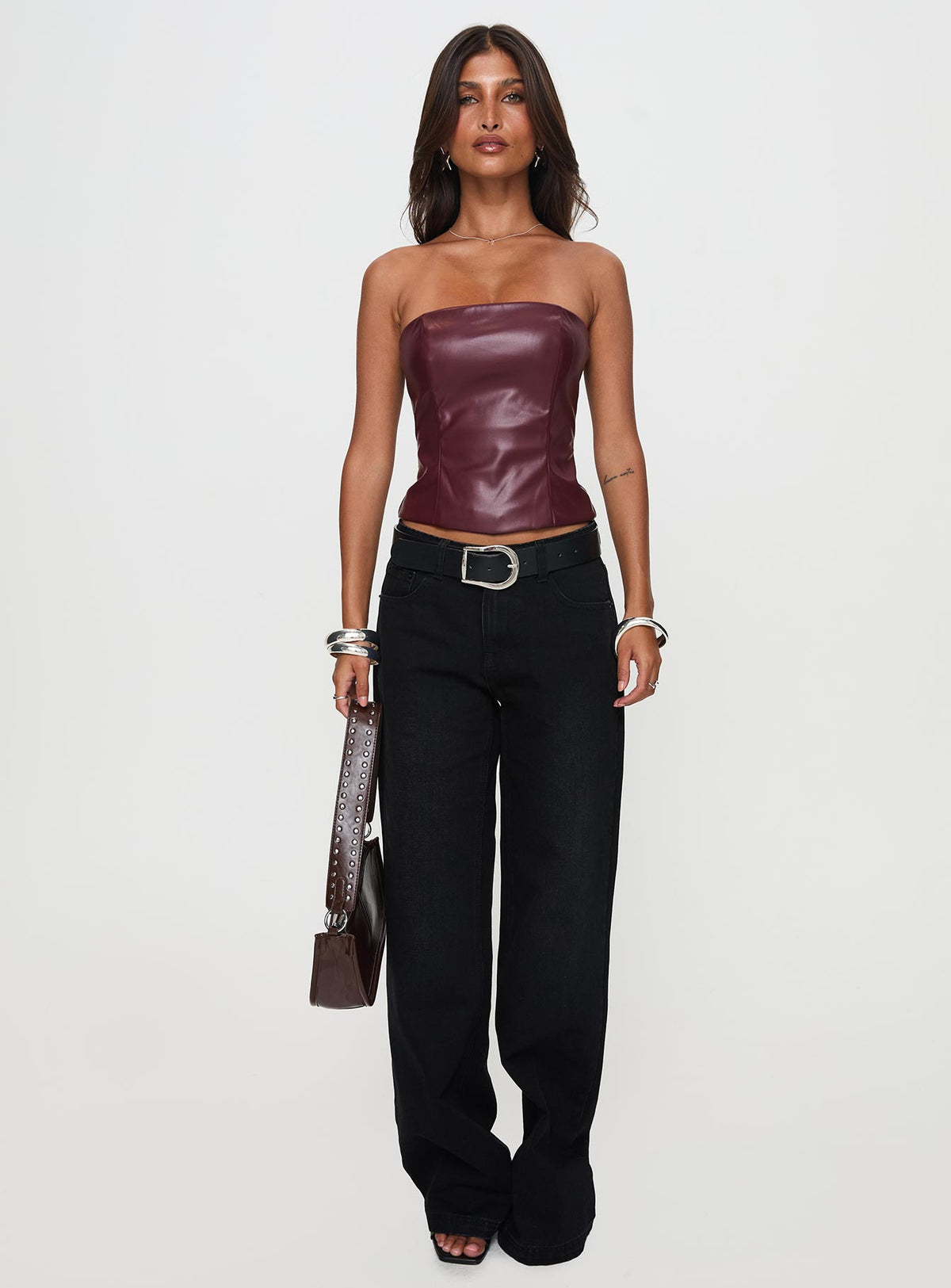 front view of model wearing Princess Polly Oaklee Strapless Faux Leather Top Burgundy Sleeveless straight 