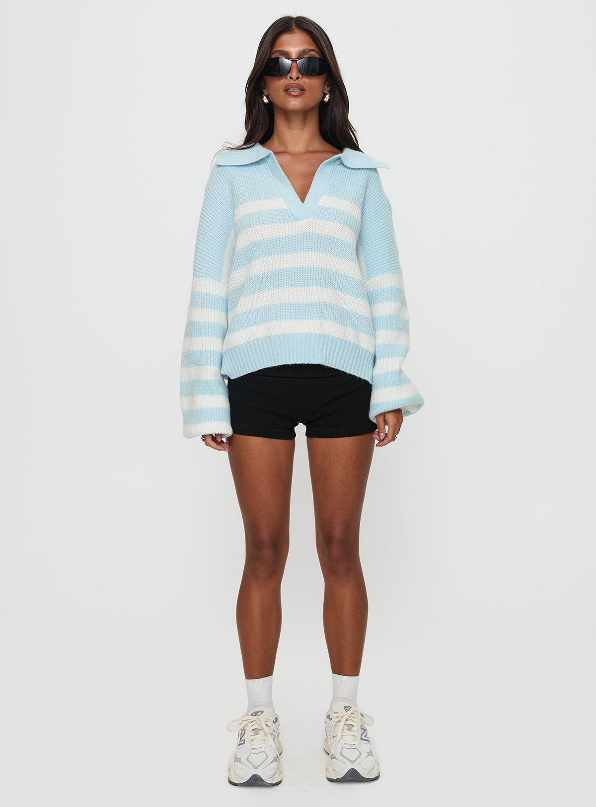 side view of model wearing Princess Polly Carolena Long Sleeve Collared Knit Sweater Blue / White Stripe Longline Jumpers Jumpers 