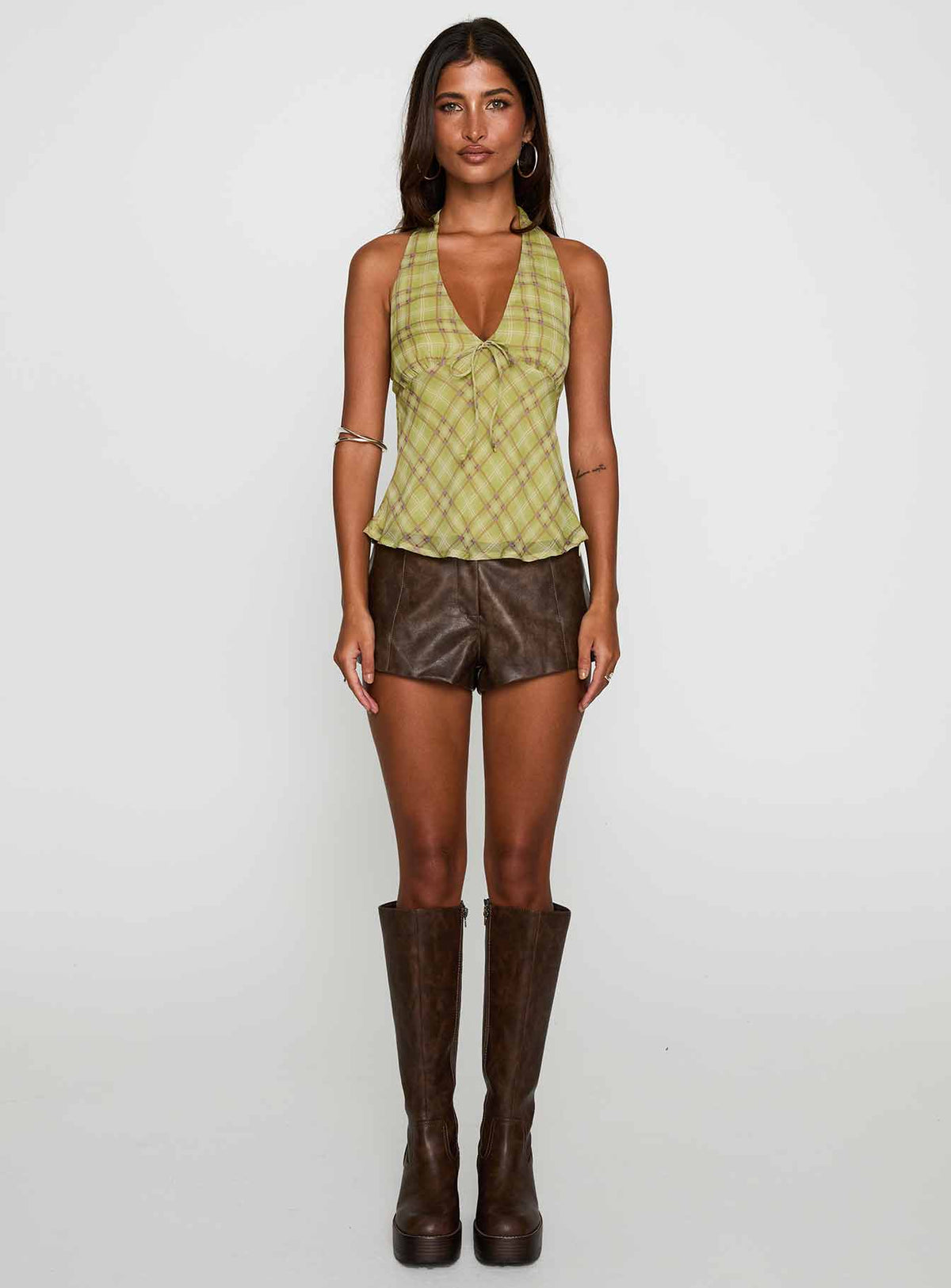 front view of model wearing Princess Polly Amalthea Top Green Check Sleeveless Plunger 