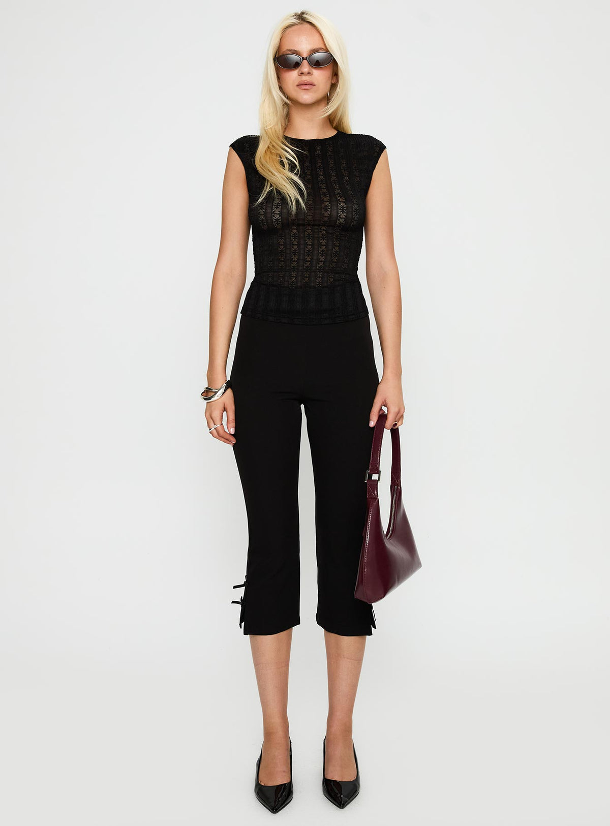 back view of model wearing Princess Polly Keep It Moving Top Black Sleeveless Crew Neck 